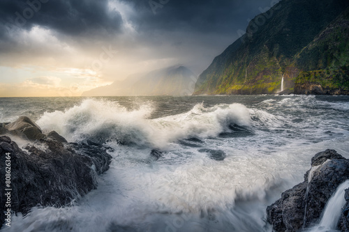 Dramatic Sunrise over Crashing Waves on Madeira's Northern Cliffs photo