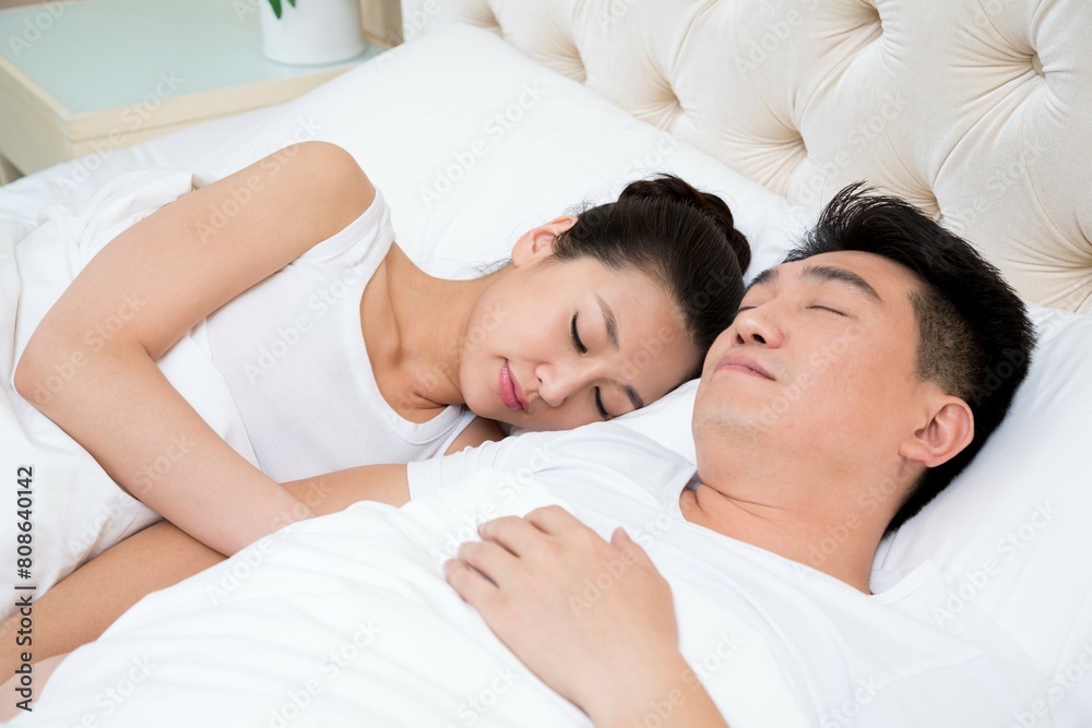 Husband and wife lying on the bed Husband and wife lying on the bed