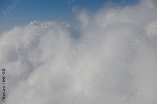 Fototapeta Naklejka Na Ścianę i Meble -  Aerial View Beauty white clouds on blue sky with soft sun light, Nature view fluffy clouds on pastel blue sky background