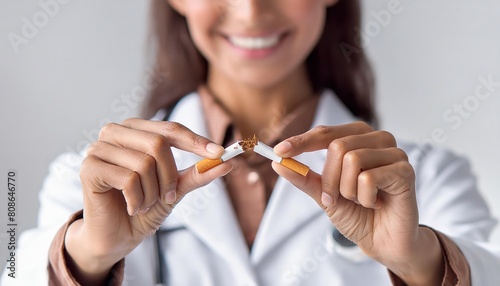 doctor breaks a cigarette  rejection of tobacco  stop smoking 