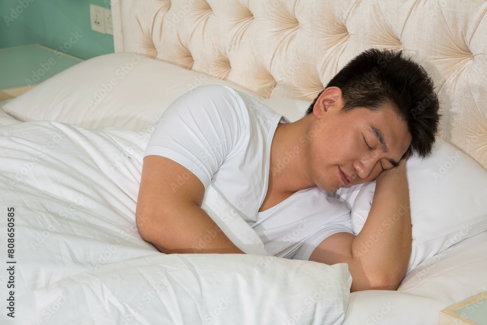 Middle-aged man to rest in the bedroom Middle-aged man to rest in the bedroom