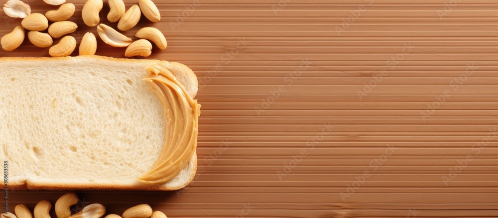 The menu concept features a delectable peanut butter sandwich made with buttered bread or toast and nut butter It is presented on a food background with copy space viewed from the top The menu concept features a delectable peanut butter sandwich made with buttered bread or toast and nut butter It is presented on a food background with copy space viewed from the top