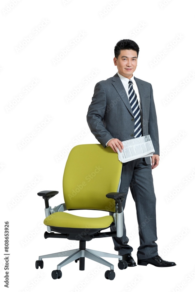 Shed middle-aged business man standing beside the chair Shed middle-aged business man standing beside the chair