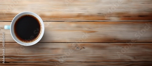 Top view of a wooden table with a white cup of espresso coffee and a black cup of hot coffee leaving plenty of space for an image. Copy space image. Place for adding text and design