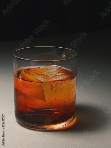 Negroni glass with garnished orange slice