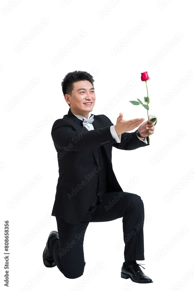 Shed middle-aged business man holding a rose Shed middle-aged business man holding a rose