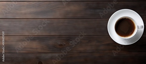 Top view of a wooden table with a white cup of espresso coffee and a black cup of hot coffee leaving plenty of space for an image. Copy space image. Place for adding text and design