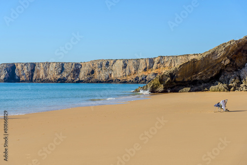 calm sandy beach on the shores of the Atlantic Ocean, famous tourist town Sagres, Portugal