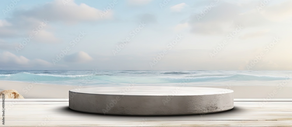 Front view of a grungy grey concrete stone platform podium for cosmetics or products set against a white beach sand background with copy space image