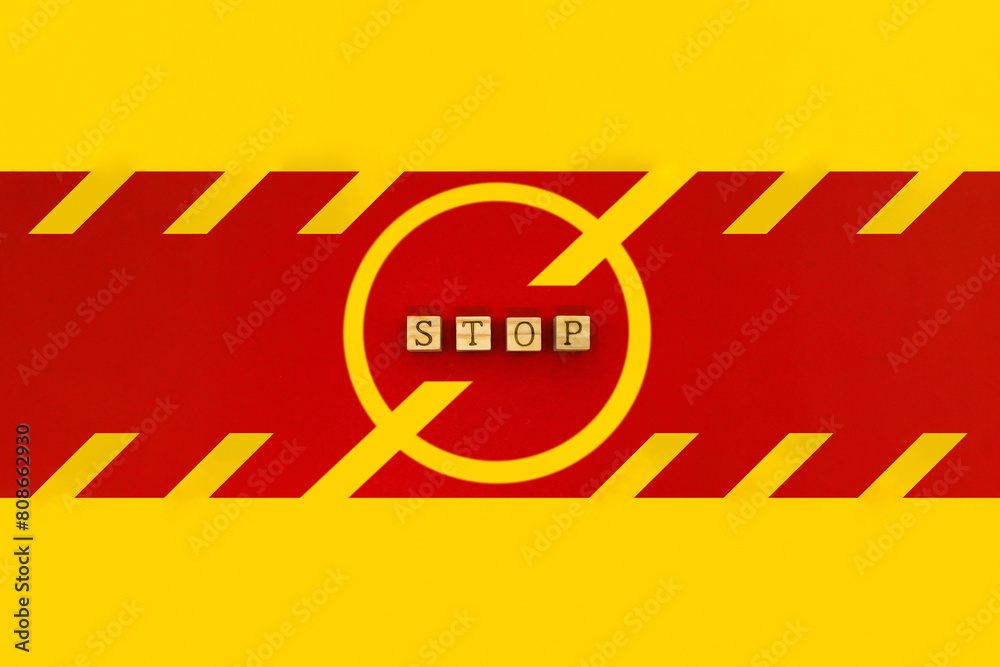 Φωτογραφία 赤いラインにSTOPのアルファベットを並べた黄色い禁止マークの看板