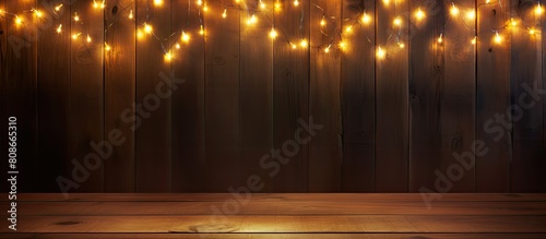 A side view copy space image of a garland made of burning lights placed on a wooden background enhancing the concept of abstract backgrounds photo