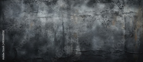 A frightening dark wall with a grungy cement texture covered in scratches making it an ideal background for a copy space image