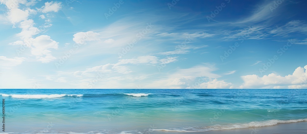 Fototapeta premium The serene ocean vista framed by a clear sky evokes thoughts of relaxation and exploration perfect for promoting the joys of holidays and seaside adventures Copy space image