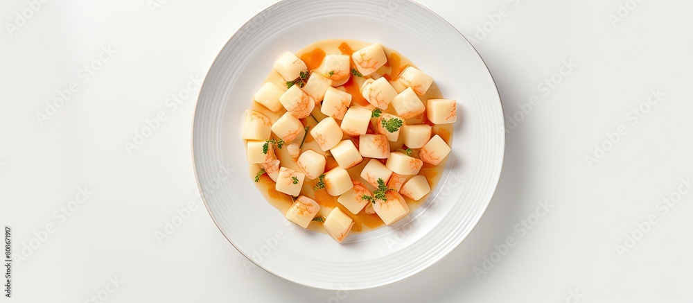 A top down view of prawns and Emmental cheese arranged on a white plate creating a visually appealing copy space image A top down view of prawns and Emmental cheese arranged on a white plate creating a visually appealing copy space image