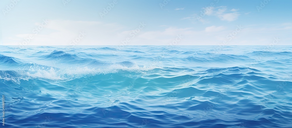 A scenic blue ocean with rippling waves and abstract patterns serving as a captivating nature inspired backdrop image. Copy space image. Place for adding text and design