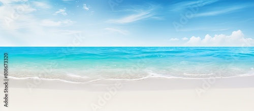 Summer beach and holiday background with copy space image featuring a serene combination of blue crystal water and white sand