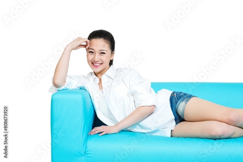 Shed young woman lying on the sofa to rest