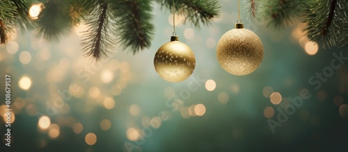 Close up of Christmas balls hanging on branches of an indoor fir tree creating a beautiful copy space image
