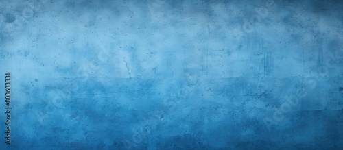 A textured blue painted wall provides a background with copy space image