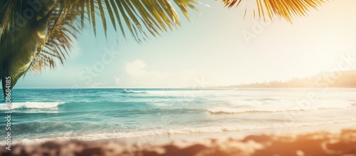 A vintage tone filter adds a touch of color to this abstract background featuring a blurred tropical beach bokeh sun rays and waves It creates a copy space image that conveys the essence of outdoor s