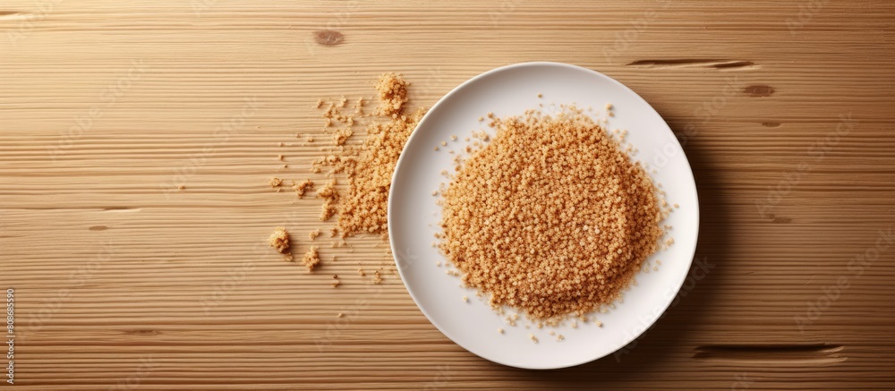 An aerial view of a plate with breadcrumbs scattered across it leaving a wide empty space for a copy space image An aerial view of a plate with breadcrumbs scattered across it leaving a wide empty space for a copy space image
