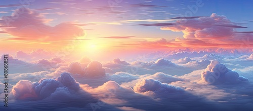 The sky displays a variety of vibrant colors as the sun sets above the clouds creating a captivating copy space image