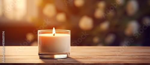 A soy candle with a wooden wick creates a natural ambiance. Copy space image. Place for adding text and design