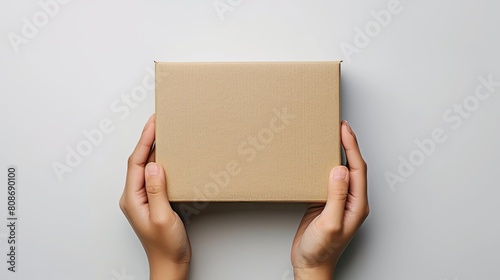 Empty Cardboard Box in Hands © Richafuji