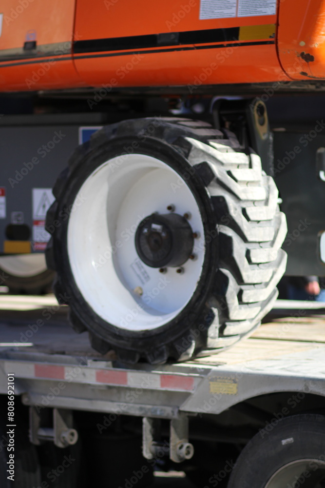 Dump truck resting on a flatbed trailer Dump truck resting on a flatbed trailer