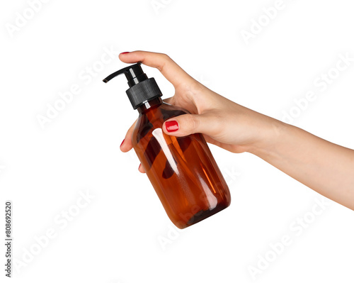 Hand holding plastic tube product on isolated background.