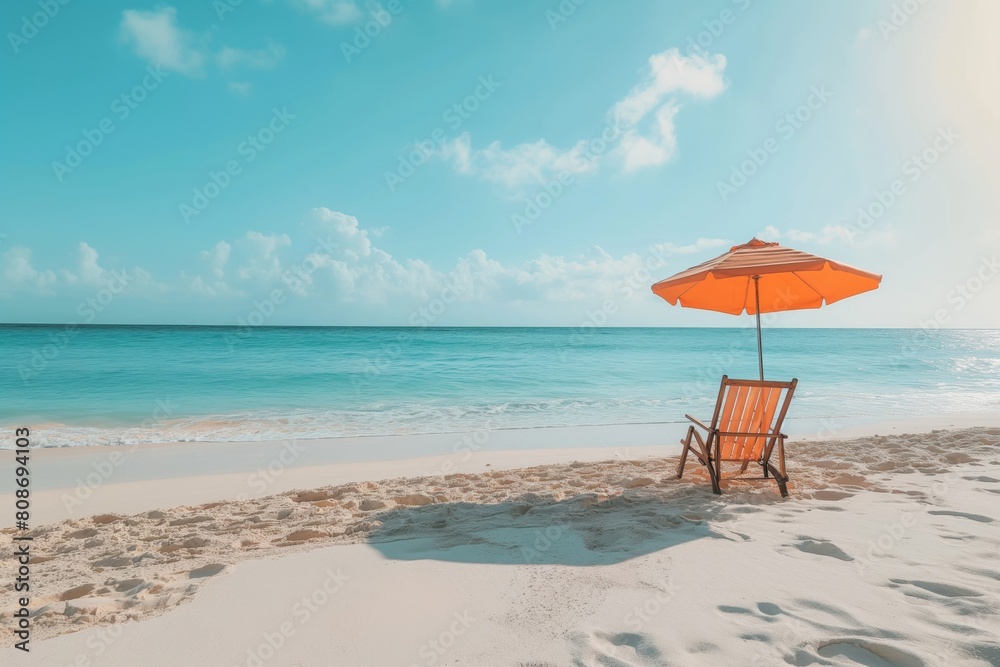 Tranquil beach scene with a solitary chair under an orange umbrella, embodying relaxation