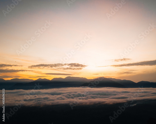 Golden dawn over the mountains of the Titiwangsa range  encircled by a sea of clouds.