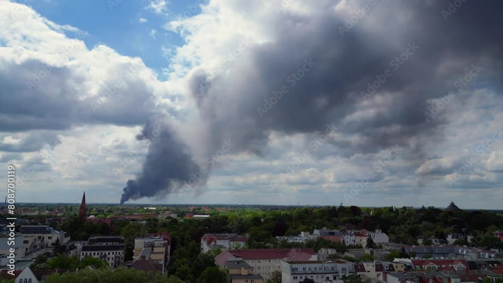 catastrophic Dense smoke plume major fire above berlin cloudy skyline. Wonderful aerial top view flight 
fly reverse drone
4k