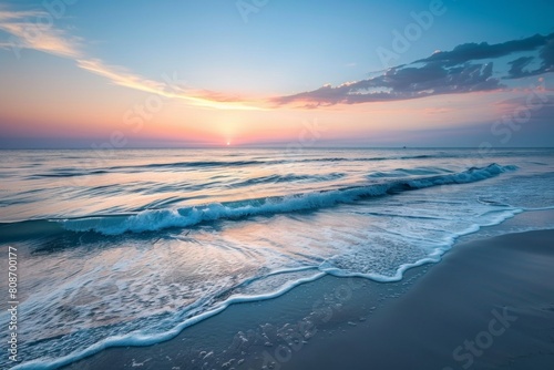 Pastel sunset over calm ocean waves