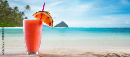 A refreshing cocktail awaits on a tropical beach where the vibrant sand invites a summer escape It s the perfect image for a seaside vacation. Copy space image. Place for adding text and design