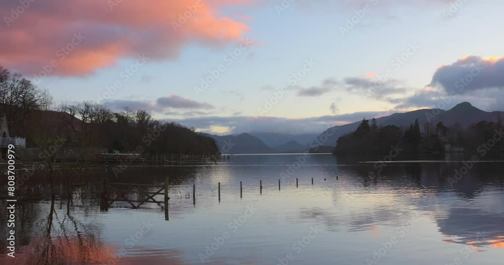 Cinematic scene during sunset of flooded region in Derwentwater lake district, England. Cinematic scene during sunset of flooded region in Derwentwater lake district, England.