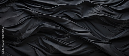 A wrinkled plastic surface on a black background serves as a high quality royalty free stock photo with realistic texture for overlay copy space and photo effects
