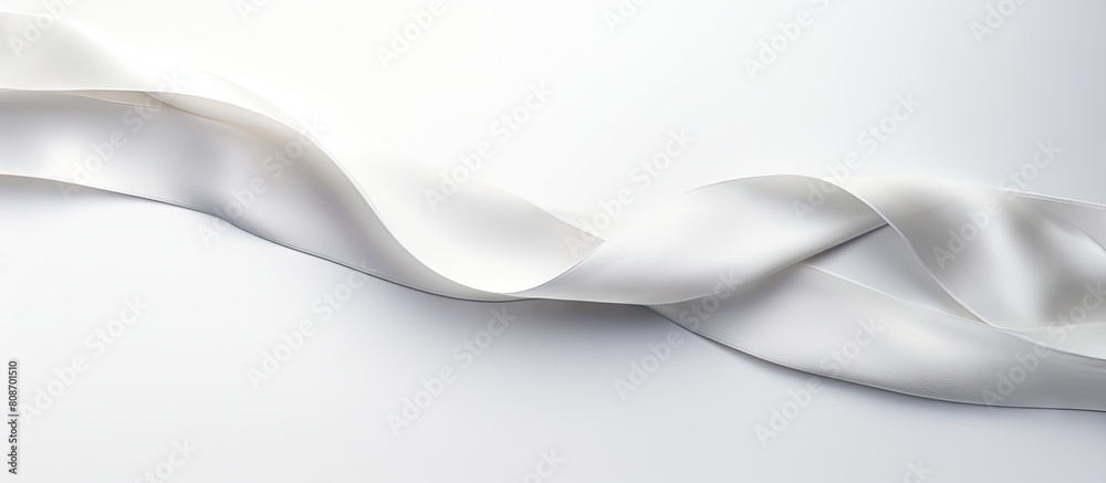 A silk ribbon displayed on a white background leaving empty space for additional images or content A silk ribbon displayed on a white background leaving empty space for additional images or content