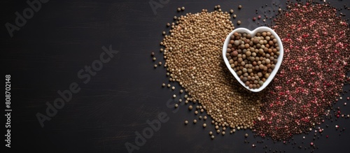 Top view of gray background with the word LOVE written in buckwheat creating a copy space image This image symbolizes a food supplies crisis and the importance of food donations during quarantine iso