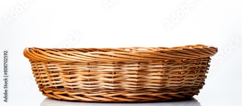 A wicker basket is featured in a copy space image with a white background photo