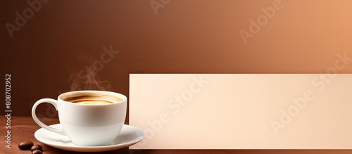 Coffee cup on a blank card with copy space image