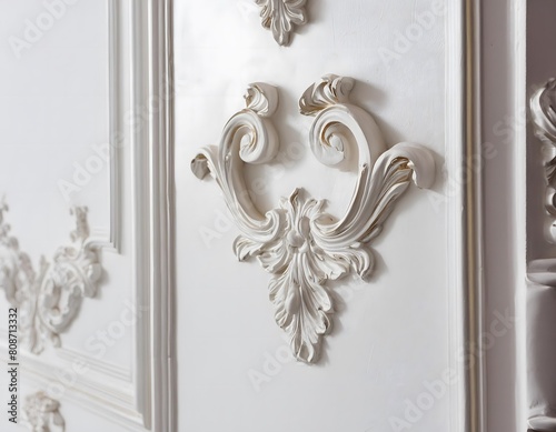 Close-up of white stucco decoration bas-relief with stucco mouldings rococo element.