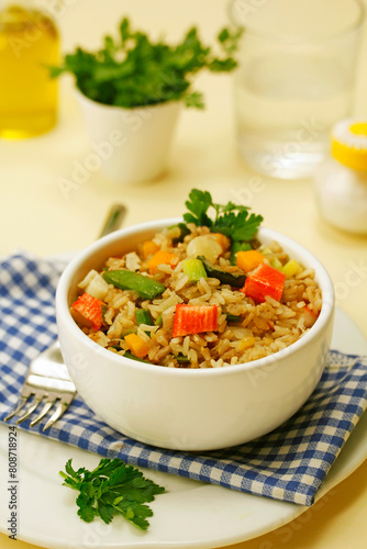 Wholemeal rice with surimi and vegetables.