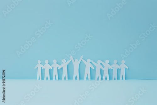 Paper people holding hands in electric blue canvas
