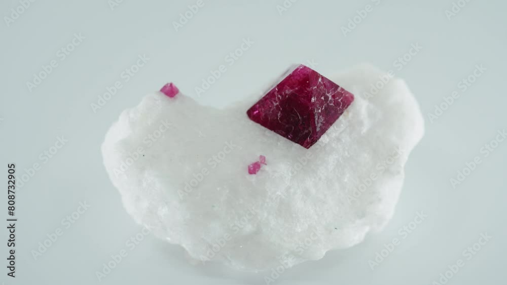Red pyramidal crystal on white ground rotating Red pyramidal crystal on white ground rotating