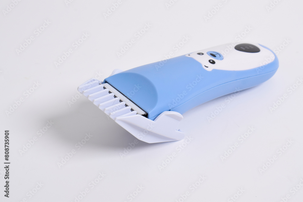 Wireless hair trimmer for babies and children isolated on a white background. Wireless hair trimmer for babies and children isolated on a white background.