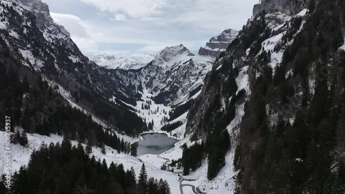 Close up drone view of frozen mountain lake Tahlalpsee Filzbach Glarus Nord Schweiz photo