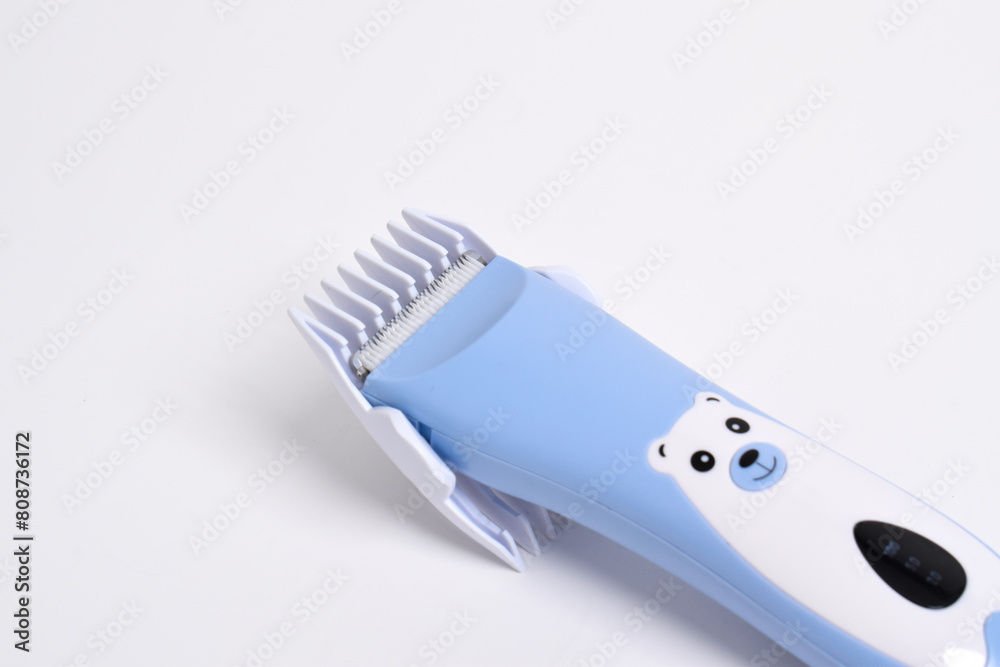 Wireless hair trimmer for babies and children isolated on a white background. Wireless hair trimmer for babies and children isolated on a white background.
