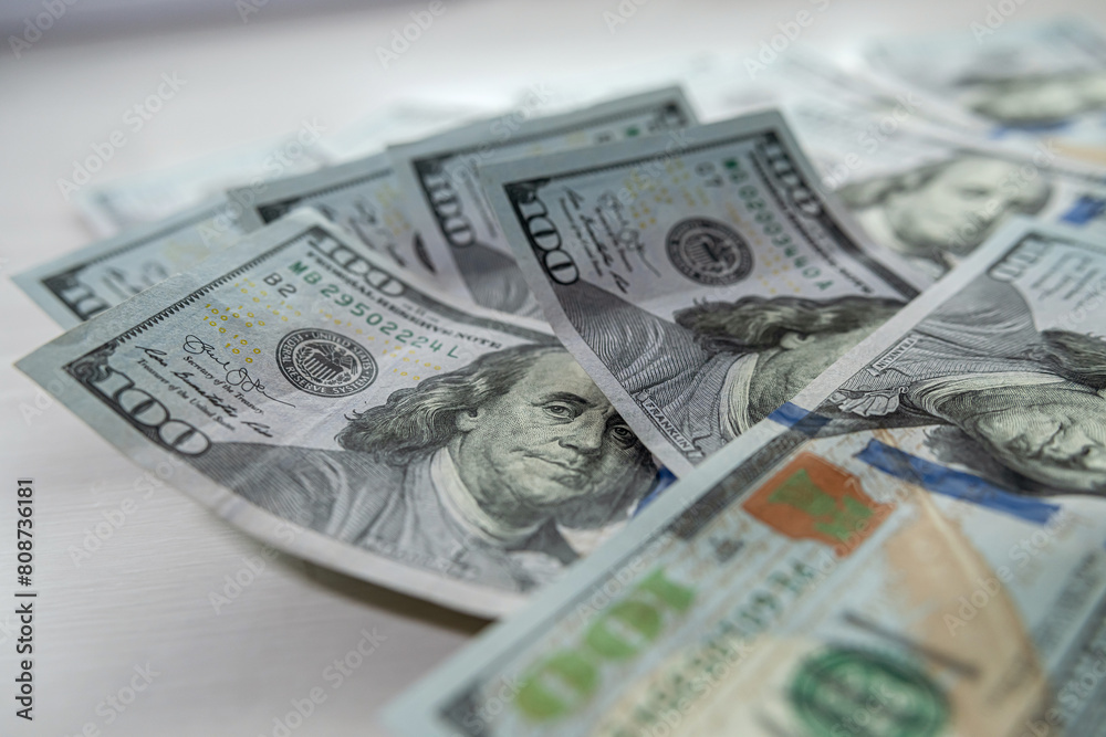 Pile of New USD Banknotes new 100 dollar bill finance background Pile of New USD Banknotes new 100 dollar bill finance background