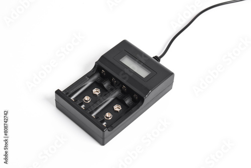 Black Rechargeable battery charger for for AA, AAA and PP3 batteries isolated on white background photo